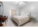 Bright bedroom with a white bed, tile floors, and a ceiling fan for a comfortable and relaxing atmosphere at 14607 Traders Path, Orlando, FL 32837