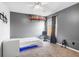 Cozy bedroom with a bed, carpet flooring, and a window offering natural light and comfort at 14607 Traders Path, Orlando, FL 32837