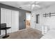 Neutral bedroom with carpet flooring, large closet space, and a ceiling fan for added comfort at 14607 Traders Path, Orlando, FL 32837