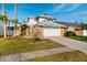 Charming two-story home featuring a two-car garage, brick accents, mature landscaping, and a well-maintained lawn at 14607 Traders Path, Orlando, FL 32837