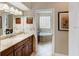 Bathroom features a large vanity and access to the tub and shower at 14872 Faversham Cir, Orlando, FL 32826