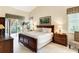 Spacious main bedroom with a king-size bed and private access to the patio at 14872 Faversham Cir, Orlando, FL 32826