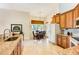 Bright kitchen with breakfast nook, granite counters, and wood cabinets at 14872 Faversham Cir, Orlando, FL 32826