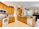 Kitchen features granite countertops, ample wood cabinets, and a breakfast bar at 14872 Faversham Cir, Orlando, FL 32826