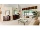 Spacious living room with sofa, glass-top coffee table, and decorative accents at 14872 Faversham Cir, Orlando, FL 32826