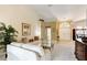 Living area features a sofa, and views to entry and dining area at 14872 Faversham Cir, Orlando, FL 32826