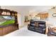 Living room features comfortable seating and views into the kitchen area at 14872 Faversham Cir, Orlando, FL 32826