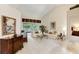 Living room with light-colored sofa and large windows at 14872 Faversham Cir, Orlando, FL 32826