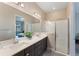 Spa-like bathroom with double vanity and walk-in shower at 153 Villa Domani Cir, Davenport, FL 33896