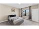 Simple bedroom with large window and ensuite bathroom at 153 Villa Domani Cir, Davenport, FL 33896