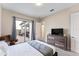 Spacious bedroom with backyard access and built-in TV stand at 153 Villa Domani Cir, Davenport, FL 33896