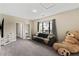 Bright bedroom with large window and plush carpeting at 153 Villa Domani Cir, Davenport, FL 33896