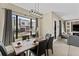 Elegant dining area with large windows and modern chandelier at 153 Villa Domani Cir, Davenport, FL 33896