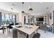 Modern kitchen with island and open floor plan at 153 Villa Domani Cir, Davenport, FL 33896