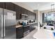 Bright kitchen with stainless steel appliances and ample counter space at 153 Villa Domani Cir, Davenport, FL 33896