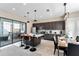 Modern kitchen with island, stainless steel appliances, and breakfast bar at 153 Villa Domani Cir, Davenport, FL 33896