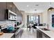 Modern kitchen features stainless steel appliances and ample counter space at 153 Villa Domani Cir, Davenport, FL 33896