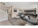Open concept living area with comfortable seating and kitchen view at 153 Villa Domani Cir, Davenport, FL 33896