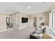 Spacious loft area with a sofa and TV at 153 Villa Domani Cir, Davenport, FL 33896
