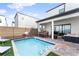 Private backyard with refreshing pool and patio furniture at 153 Villa Domani Cir, Davenport, FL 33896