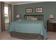 Main bedroom with a king-size bed and neutral color scheme at 1575 Weaver Oak Way, Deland, FL 32720