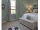 bedroom with light blue walls and a large window at 1575 Weaver Oak Way, Deland, FL 32720