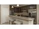 Modern kitchen with granite countertops and stainless steel appliances at 1575 Weaver Oak Way, Deland, FL 32720