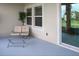 Relaxing covered patio with glass sliding doors and seating area at 1575 Weaver Oak Way, Deland, FL 32720