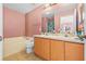 Well-lit main bathroom with a dual-sink vanity, a soaking tub, and ceramic tile flooring at 2029 Knollcrest Dr, Clermont, FL 34711