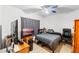 Cozy bedroom featuring neutral walls, tiled floors, and a comfortable bed, perfect for relaxation at 2029 Knollcrest Dr, Clermont, FL 34711