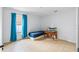Bright bedroom with tile floors, a large window, and ample space for a bed and study area at 2029 Knollcrest Dr, Clermont, FL 34711