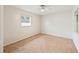 Spacious bedroom with carpeted floor and a window at 2049 Jefferson Ave, Deltona, FL 32738