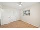 Bright bedroom with carpeted floor and double doors at 2049 Jefferson Ave, Deltona, FL 32738