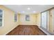 Bright bonus room with wood flooring and sliding doors at 2049 Jefferson Ave, Deltona, FL 32738