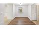 Bright dining area features modern laminate flooring, neutral paint, and a double-door closet at 2049 Jefferson Ave, Deltona, FL 32738