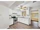 Bright kitchen features stainless steel appliances, white cabinets, and modern countertops at 2049 Jefferson Ave, Deltona, FL 32738
