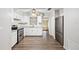 Bright kitchen features stainless steel appliances, white cabinets, and modern countertops at 2049 Jefferson Ave, Deltona, FL 32738