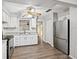 Bright kitchen features stainless steel appliances, white cabinets, and modern countertops at 2049 Jefferson Ave, Deltona, FL 32738