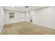 Spacious living area with neutral carpeting and lots of natural light at 2049 Jefferson Ave, Deltona, FL 32738