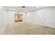 Spacious living room with carpeted floors and access to other rooms at 2049 Jefferson Ave, Deltona, FL 32738