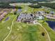 Aerial view of community with clubhouse, golf course, pool, and tennis courts at 2089 Camden Loop, Davenport, FL 33837