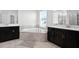 Elegant bathroom with corner bathtub and double sinks at 2089 Camden Loop, Davenport, FL 33837