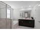 Bathroom with soaking tub and double vanity at 2089 Camden Loop, Davenport, FL 33837