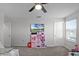 ' bedroom with twin beds and ceiling fan at 2089 Camden Loop, Davenport, FL 33837