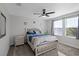 Bedroom with a queen bed and ceiling fan at 2089 Camden Loop, Davenport, FL 33837