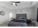 Main bedroom with plush bed and an ensuite bathroom at 2089 Camden Loop, Davenport, FL 33837