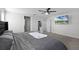 King-size bed in a spacious bedroom with large TV at 2089 Camden Loop, Davenport, FL 33837