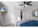 Bright bedroom with double bed and ceiling fan at 2089 Camden Loop, Davenport, FL 33837
