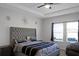 Spacious bedroom with large bed and window at 2089 Camden Loop, Davenport, FL 33837