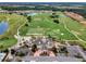 Community clubhouse with adjacent parking and golf course at 2089 Camden Loop, Davenport, FL 33837